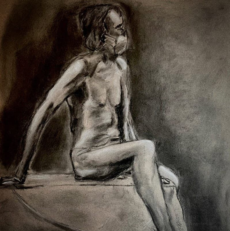 Seated figure — raised arm